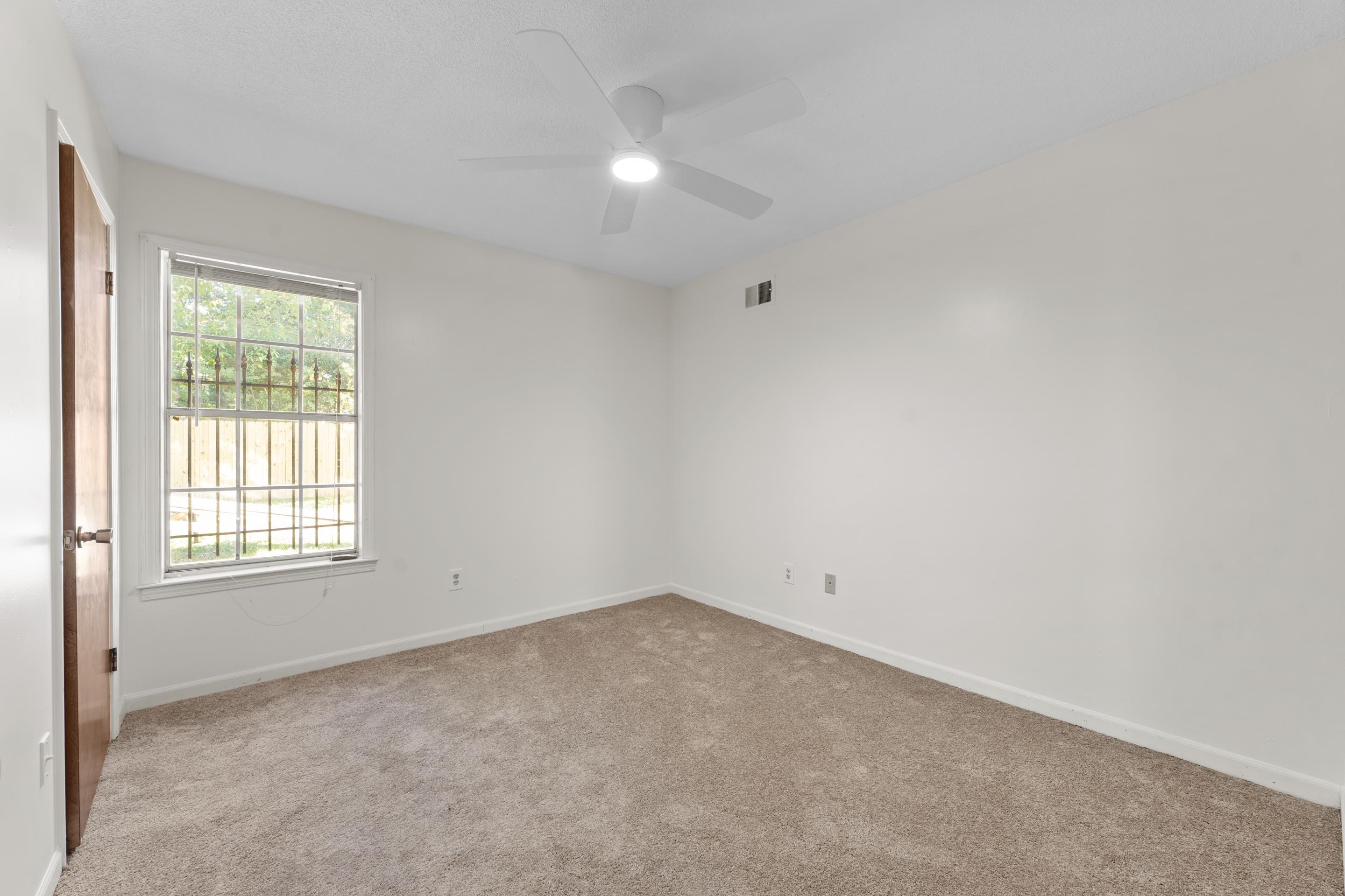 3095 Spring Hill Cove Memphis, TN 38127 - Photo 27 of 29 an empty room with a window