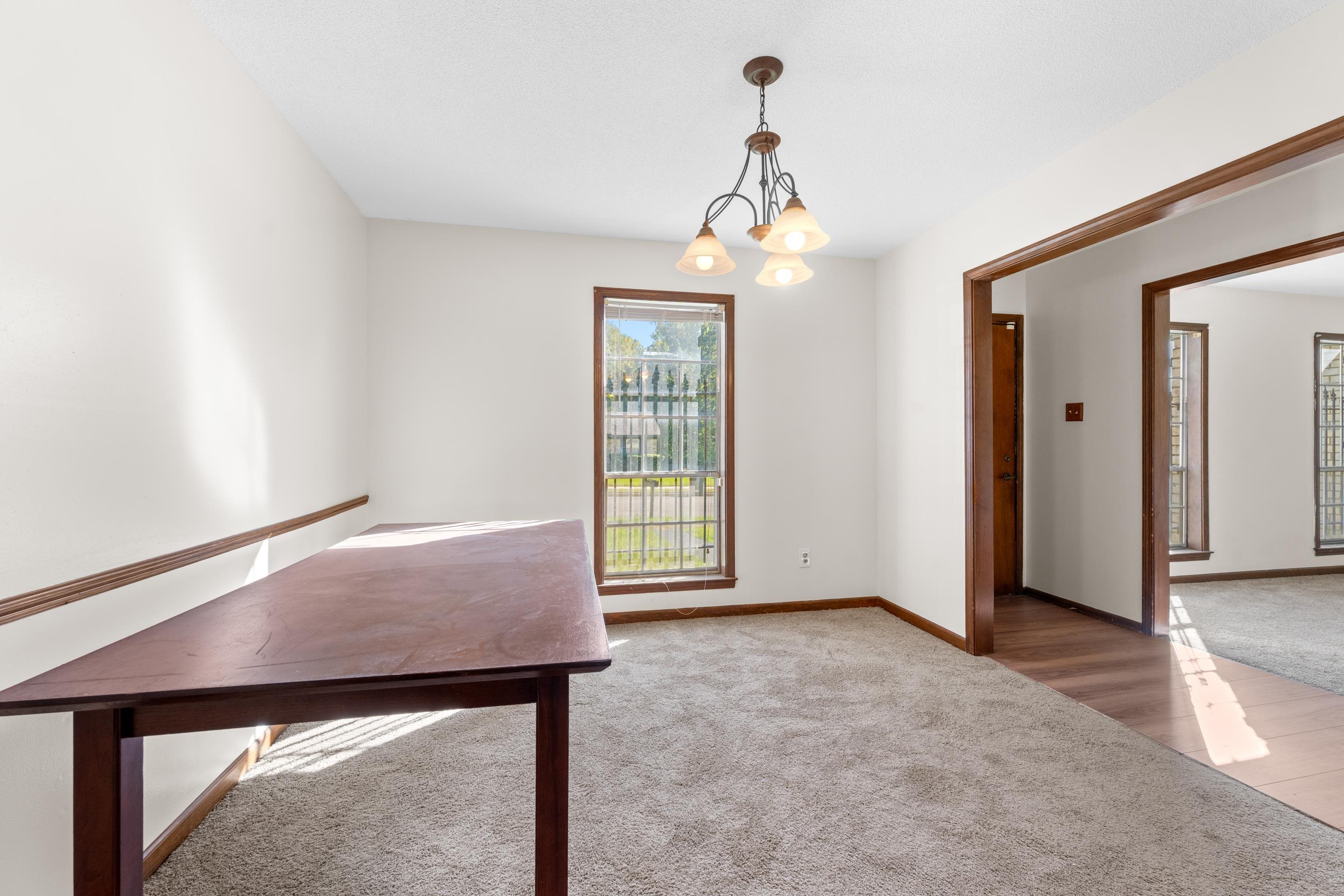3095 Spring Hill Cove Memphis, TN 38127 - Photo 6 of 29 an empty room with windows and chandelier