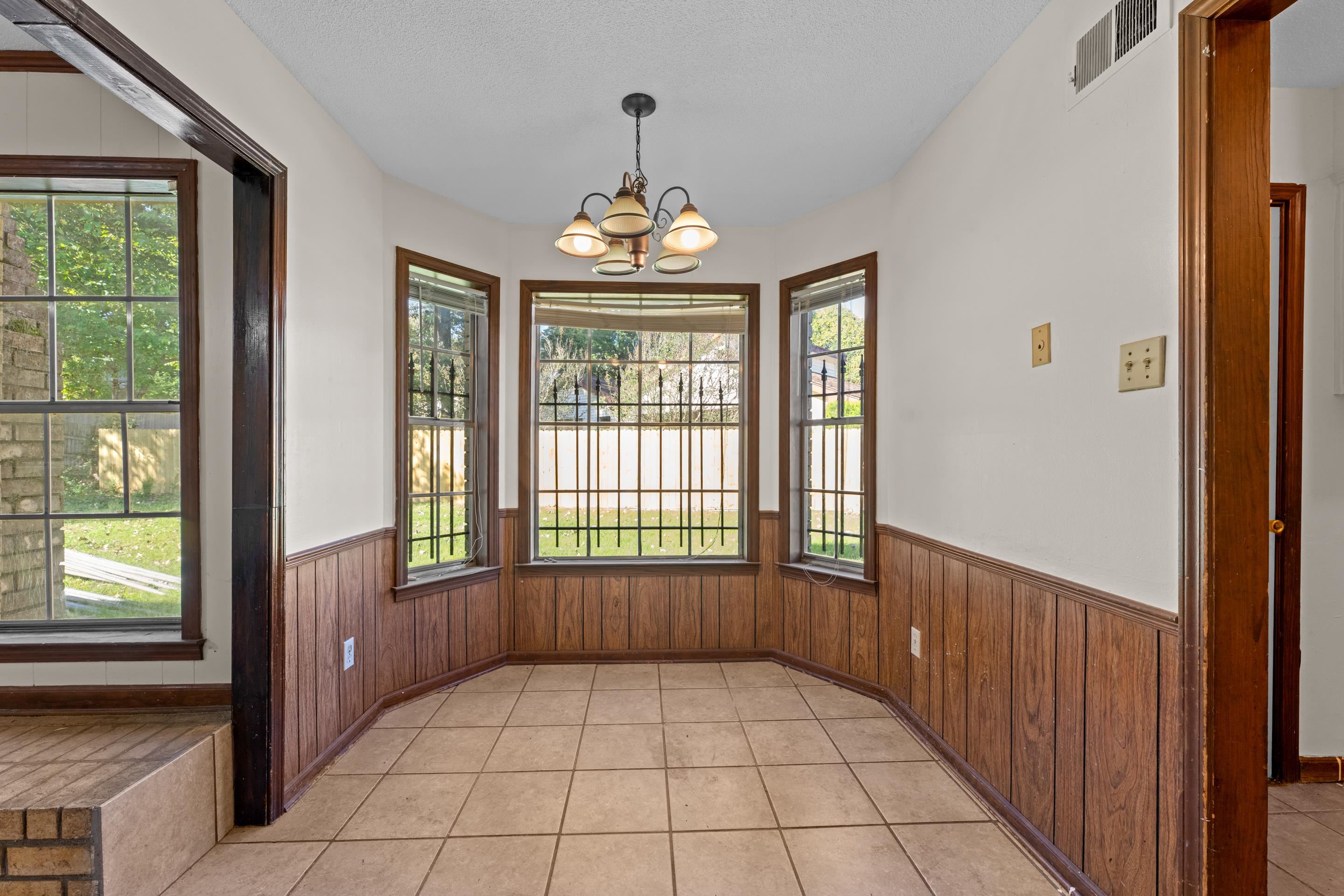 3095 Spring Hill Cove Memphis, TN 38127 - Photo 8 of 29 a view of an empty room with a window