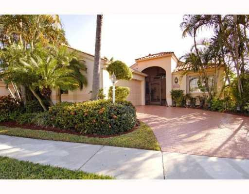 19910 Milan Terrace Boca Raton, FL 33434 - Photo 1 of 14 a front view of a house with a yard