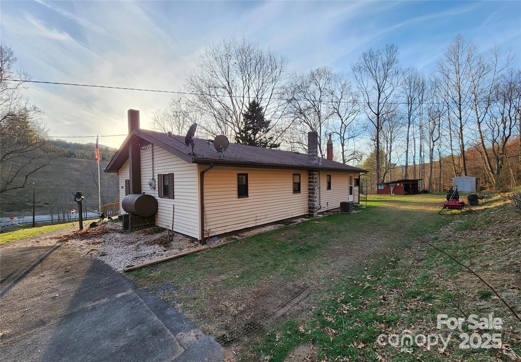 433 Deneen Road Burnsville, NC 28714 - Photo 29 of 32 a view of a house with backyard