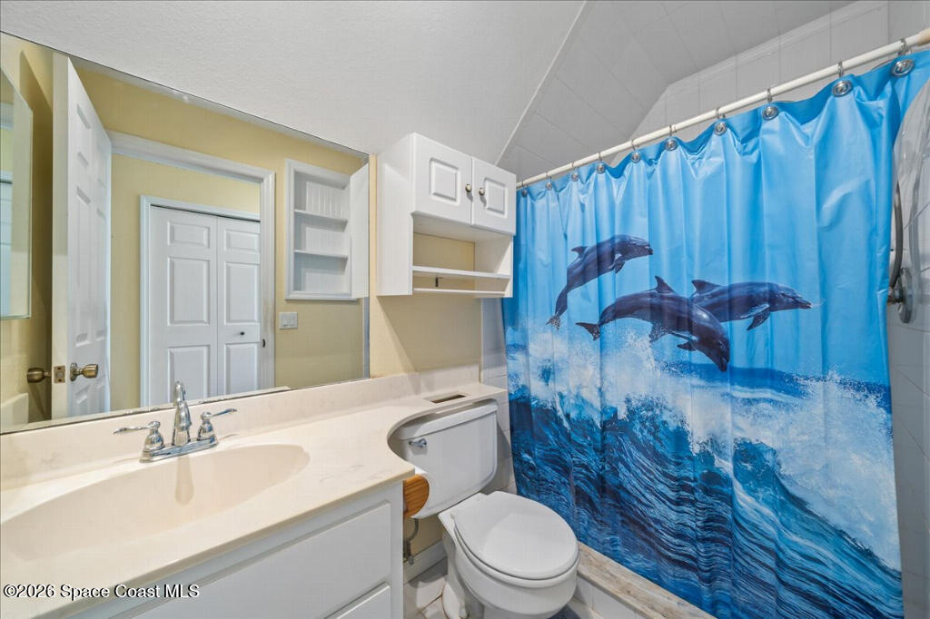 1110 Riverside Drive Titusville, FL 32780 - Photo 40 of 50 a bathroom with a sink a toilet and shower