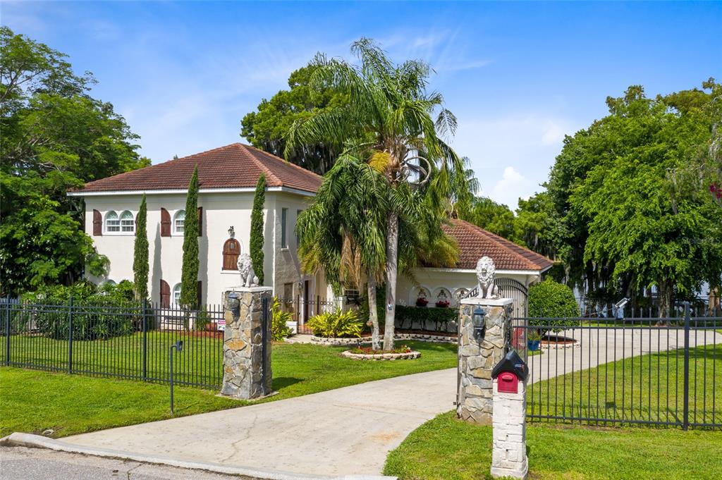 27849 Lake Jem Road Mount Dora, FL 32757 - Photo 1 of 1 Stone Column entry way with security gate. Entire property fenced