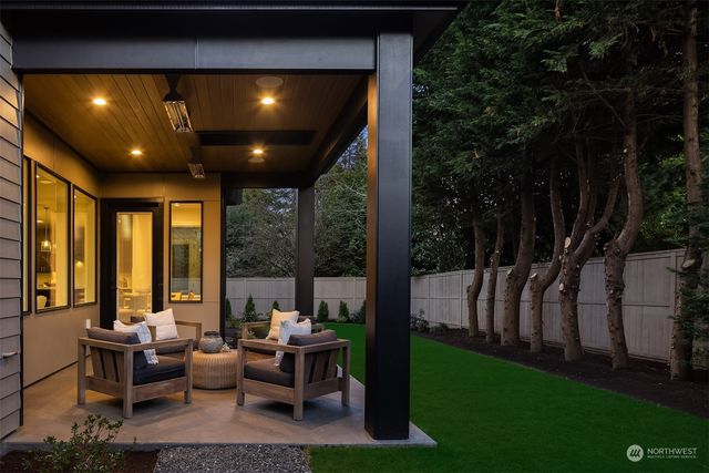 a living room with patio furniture and garden