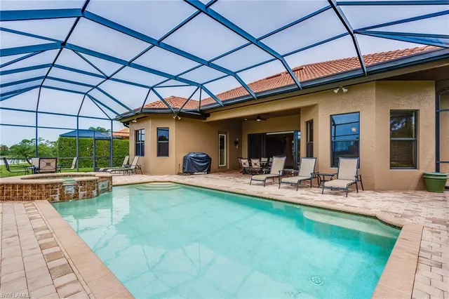 a view of a swimming pool with a patio
