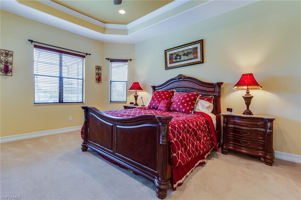7771 Cottesmore Drive Naples, FL 34113 - Photo 20 of 32 a bed room with a bed and a window