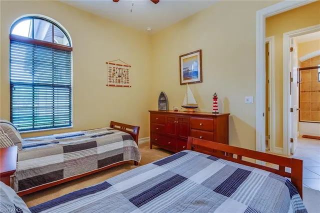 a bedroom with furniture and a window