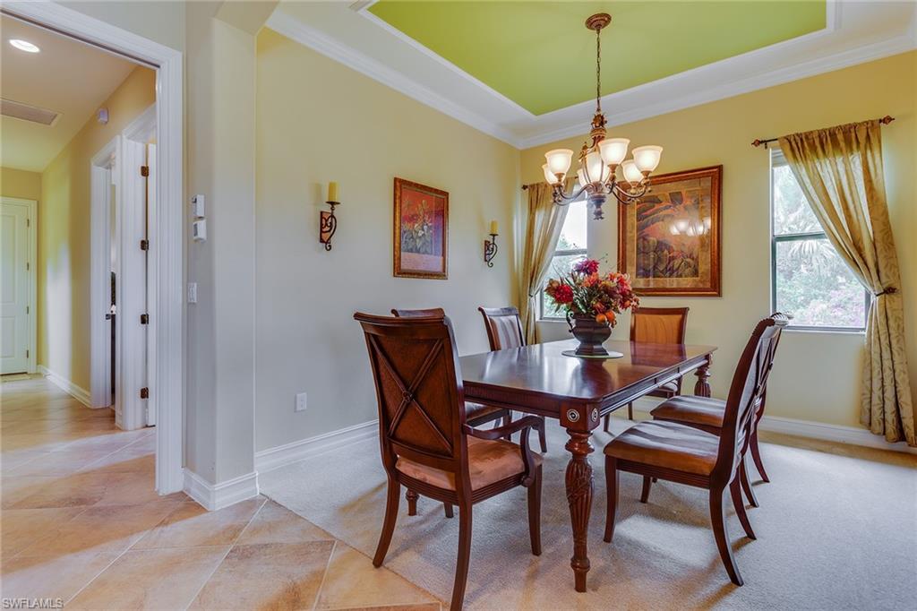 7771 Cottesmore Drive Naples, FL 34113 - Photo 7 of 32 a dining room with furniture and window