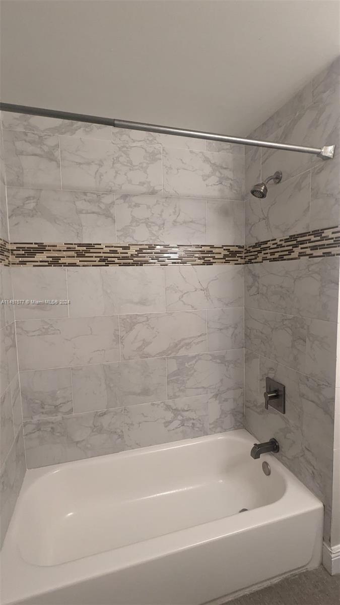 Shenandoah Davie, FL 33325 - Photo 11 of 61 a bathroom with a shower and a bath tub