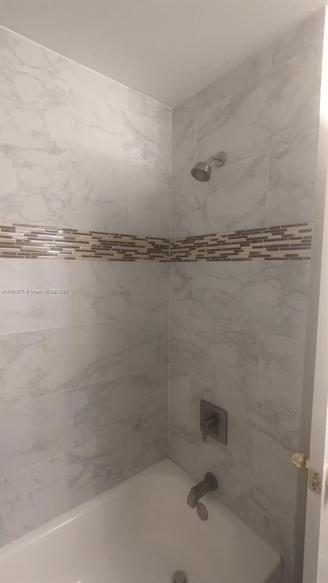 Shenandoah Davie, FL 33325 - Photo 12 of 61 a bathroom with a shower