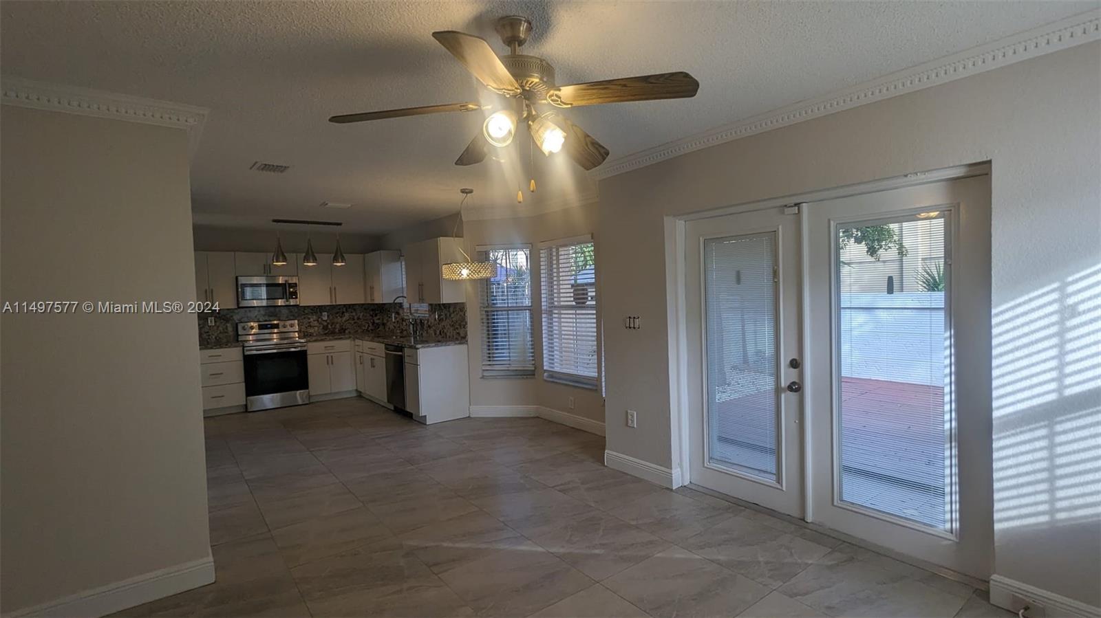 Shenandoah Davie, FL 33325 - Photo 22 of 61 a view of a kitchen with refrigerator and a sink