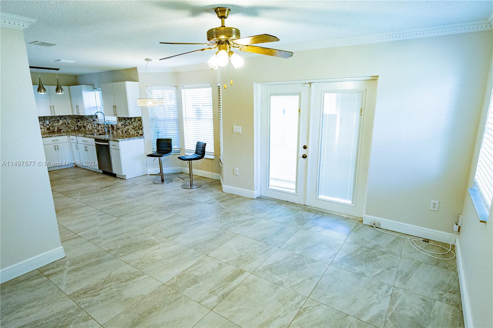 Shenandoah Davie, FL 33325 - Photo 53 of 61 a view of a kitchen with furniture and a ceiling fan