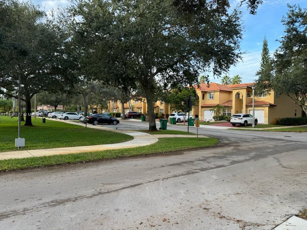 Shenandoah Davie, FL 33325 - Photo 8 of 61 a view of road with of parked cars