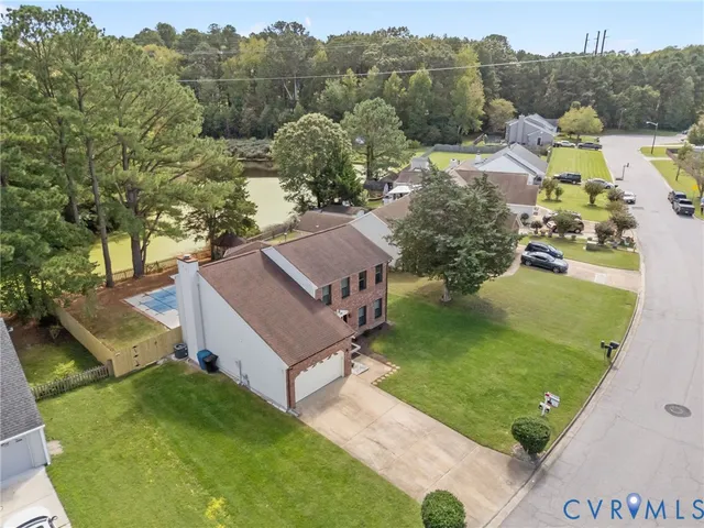 an aerial view of a house with a garden