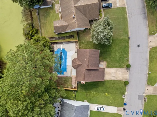 an aerial view of a house with a garden