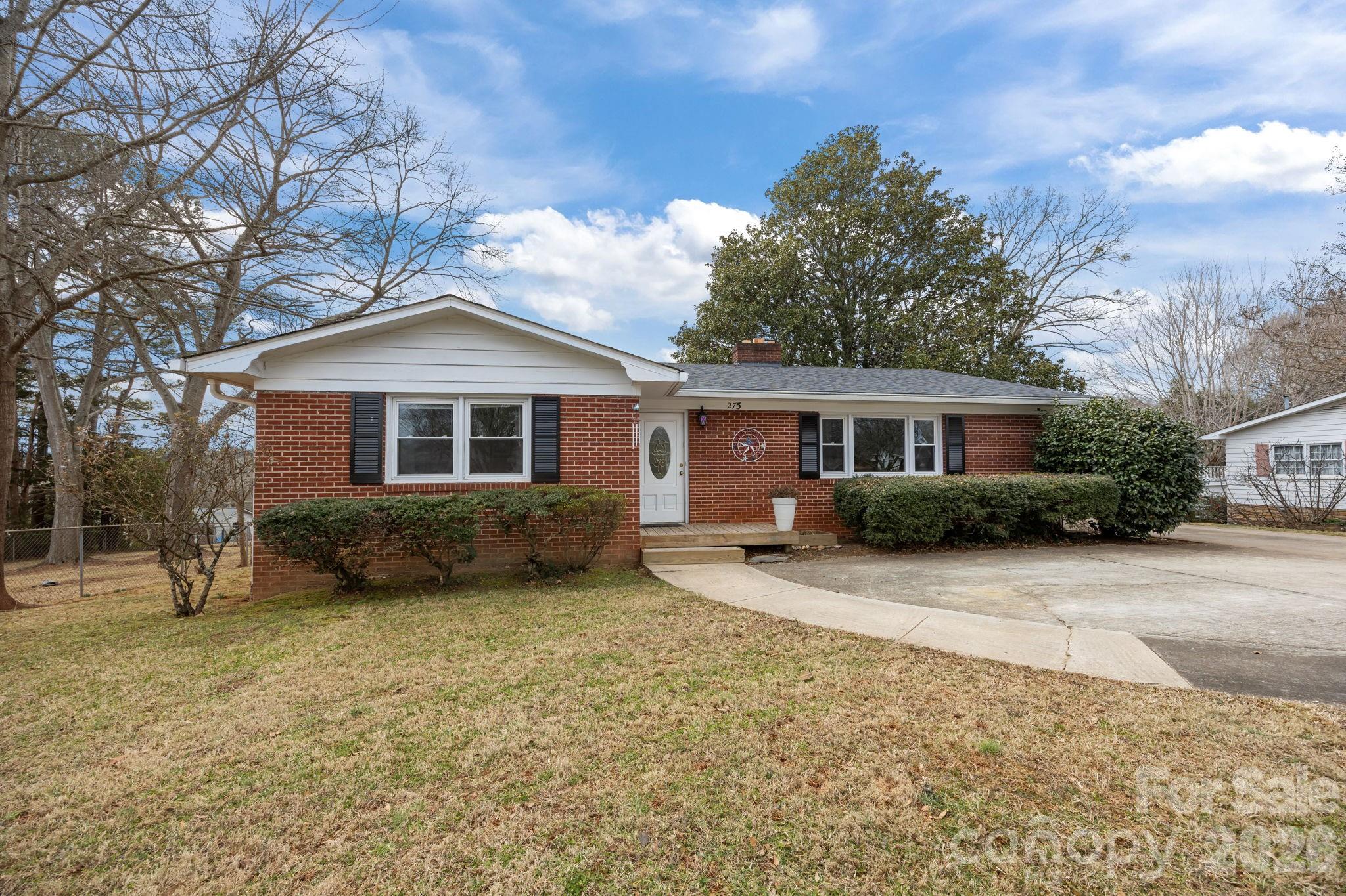 275 Tanner Street Rutherfordton, NC 28139 - Photo 3 of 44 a front view of a house with a garden