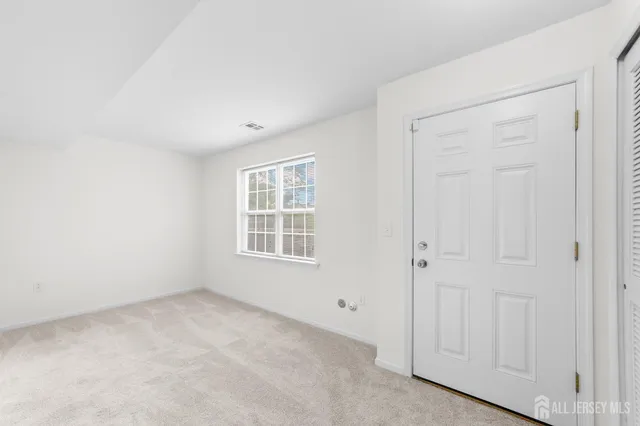 a view of a hallway with staircase