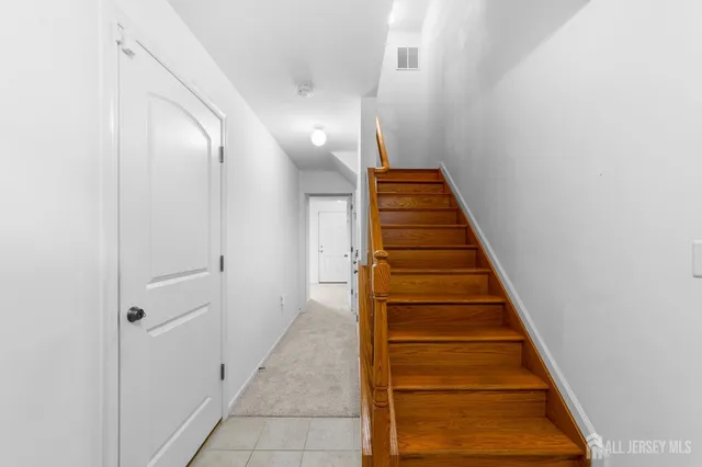 a bathroom with a toilet a sink a vanity and mirror