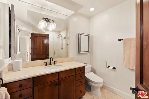 a bathroom with a shower and a toilet