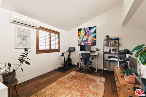 a workspace with furniture and a potted plant
