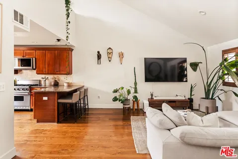 a kitchen with a sink cabinets and window