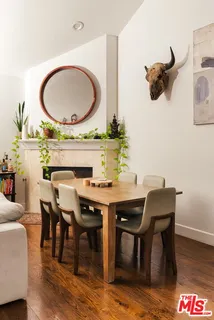 a bedroom with a bed and a potted plant