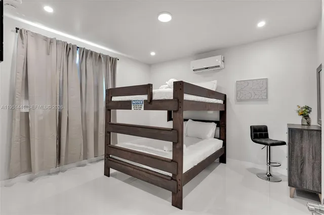 a bedroom with bed and a window