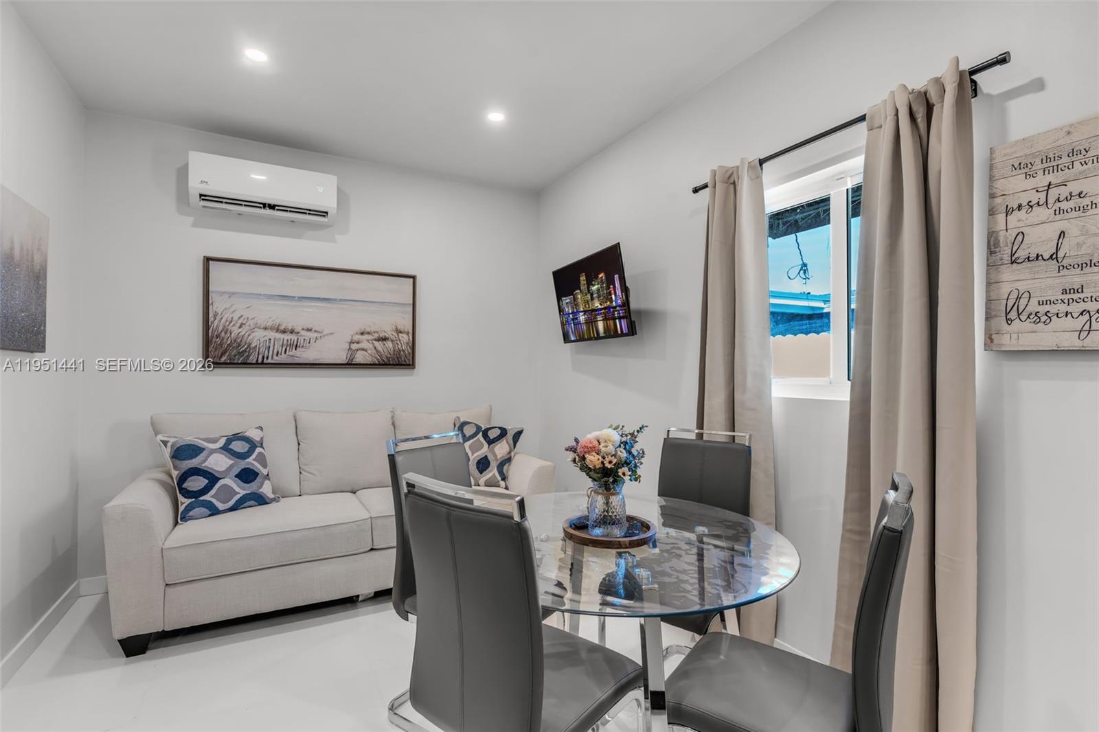 1430 Northeast 11th Street, Unit 1430 Homestead, FL 33033 - Photo 3 of 21 a living room with furniture and a painting on the wall