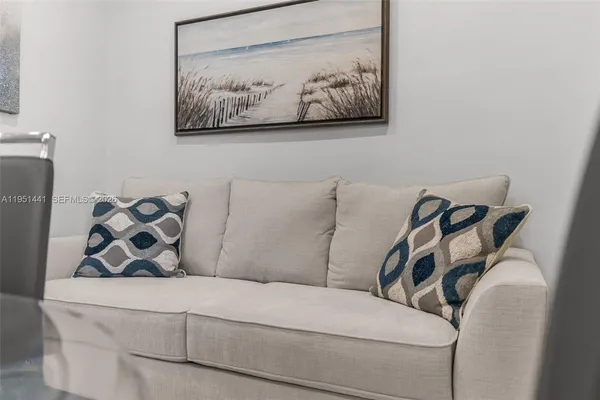 a kitchen with stainless steel appliances granite countertop a refrigerator stove a sink and a microwave