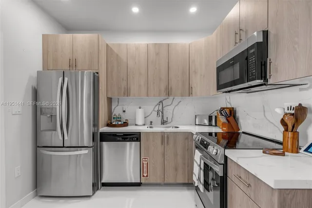 a view of a house with a yard and potted plants