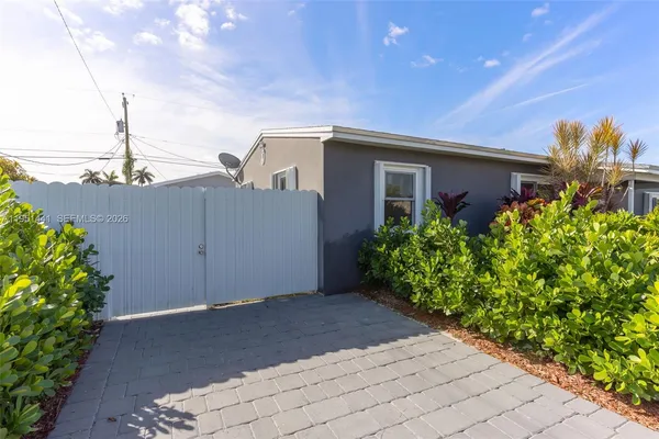 a view of a balcony with wooden floor