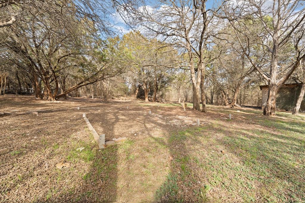 9419 Hilltop Street Rio Vista, TX 76093 - Photo 3 of 40 a view of empty space with large trees
