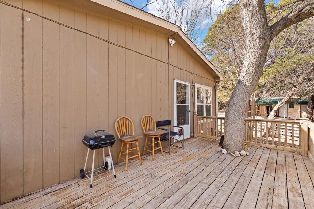 9419 Hilltop Street Rio Vista, TX 76093 - Photo 32 of 40 a view of balcony with wooden floor and outdoor seating