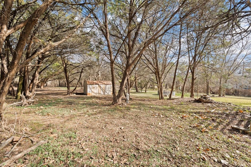 9419 Hilltop Street Rio Vista, TX 76093 - Photo 37 of 40 a view of a yard with a house