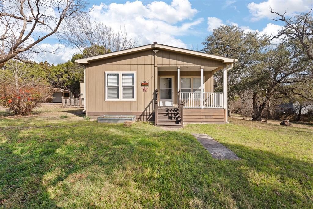 9419 Hilltop Street Rio Vista, TX 76093 - Photo 4 of 40 a front view of house with yard and seating area