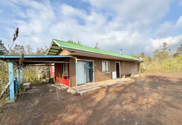 a view of a house with wooden deck and backyard