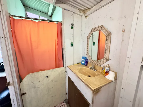 a bathroom with a sink and a mirror