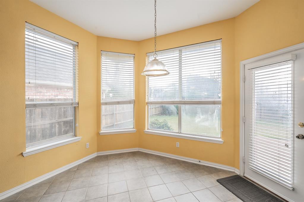 2306 Bear Run Road Arlington, TX 76001 - Photo 37 of 40 Unfurnished dining area featuring healthy amount of natural light and light tile patterned floors