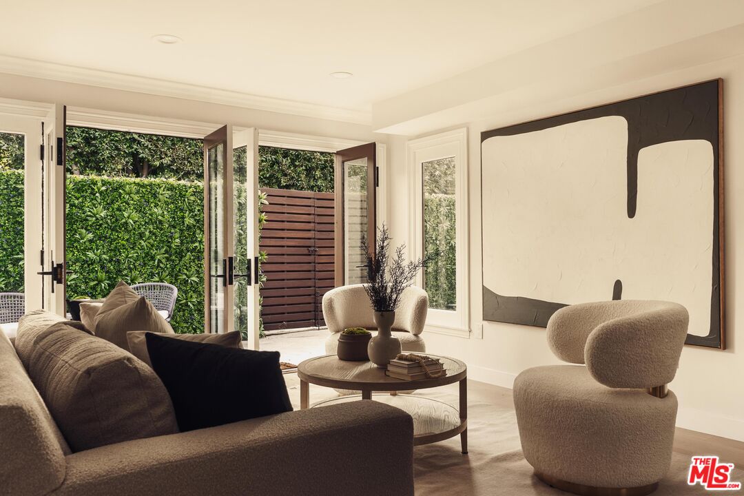 222 14th Street Santa Monica, CA 90402 - Photo 14 of 42 a living room with furniture and a large window