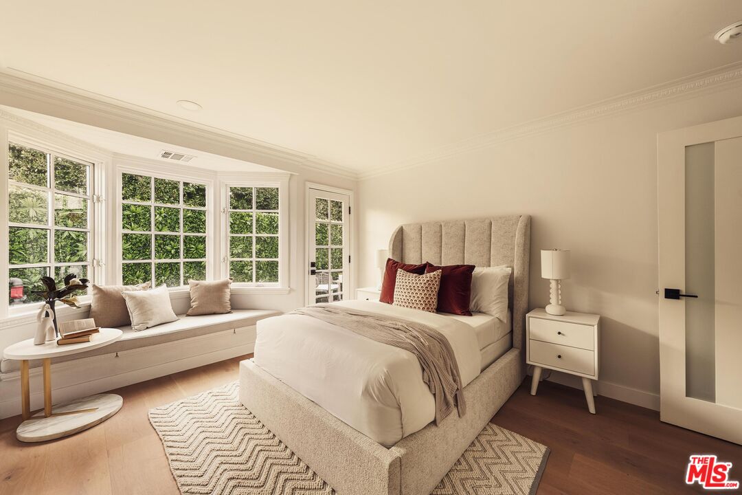 222 14th Street Santa Monica, CA 90402 - Photo 17 of 42 a spacious bedroom with a bed a couch and a large window