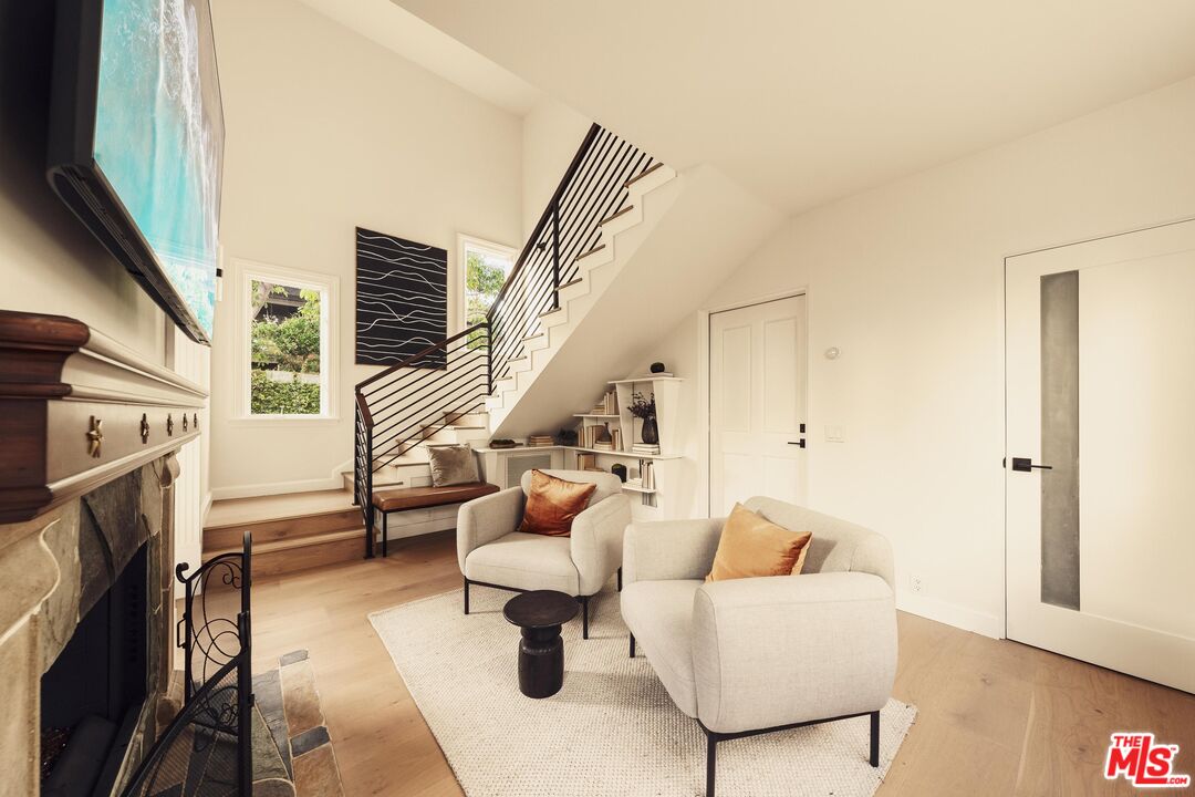 222 14th Street Santa Monica, CA 90402 - Photo 19 of 42 a living room with furniture and a fireplace