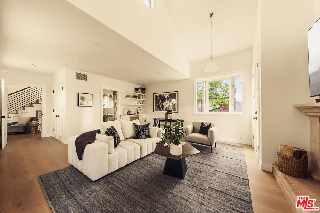 222 14th Street Santa Monica, CA 90402 - Photo 21 of 42 a living room with furniture and a couch