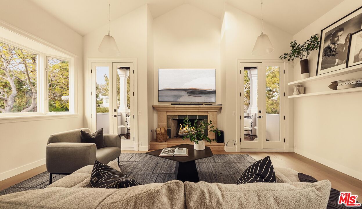 222 14th Street Santa Monica, CA 90402 - Photo 22 of 42 a living room with furniture fireplace and a large window