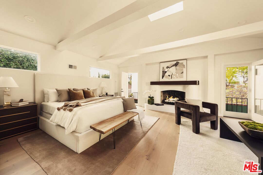 222 14th Street Santa Monica, CA 90402 - Photo 25 of 42 a spacious bedroom with a bed and a fireplace