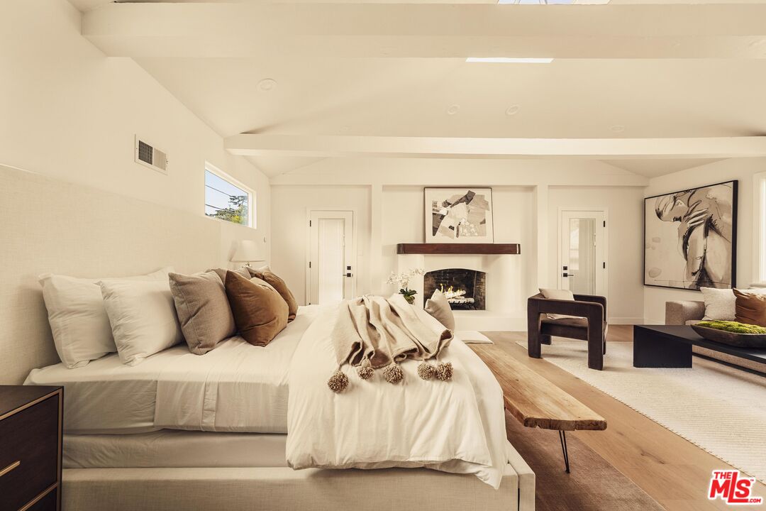222 14th Street Santa Monica, CA 90402 - Photo 26 of 42 a bedroom with a bed and a fireplace