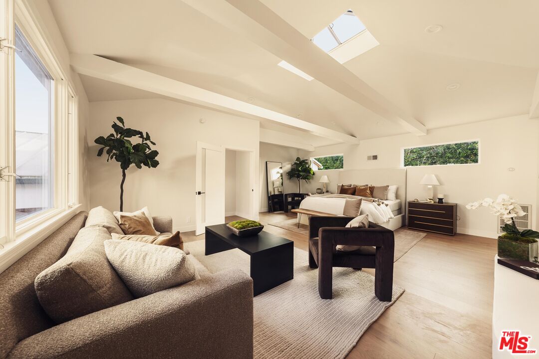 222 14th Street Santa Monica, CA 90402 - Photo 27 of 42 a living room with furniture and a large window