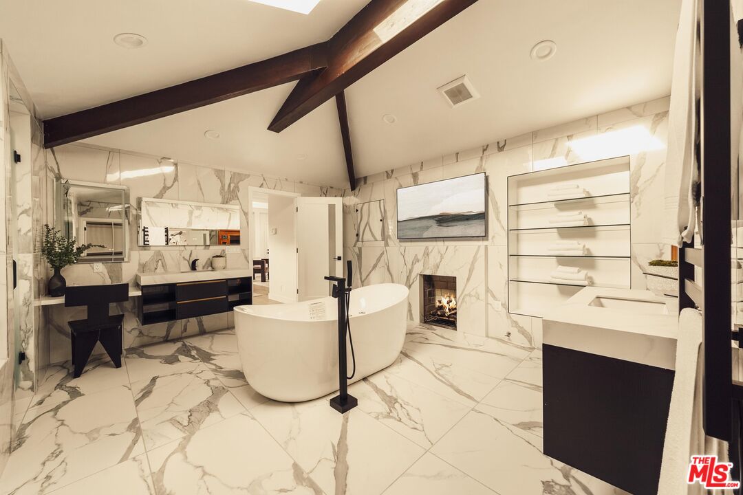 222 14th Street Santa Monica, CA 90402 - Photo 31 of 42 a living room with furniture appliances and a large window