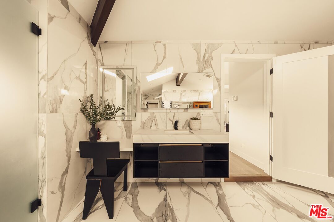 222 14th Street Santa Monica, CA 90402 - Photo 32 of 42 a view of bathroom with a sink and mirror