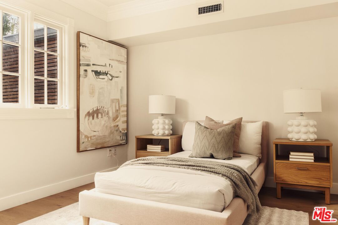 222 14th Street Santa Monica, CA 90402 - Photo 34 of 42 a bedroom with a bed and a night stand