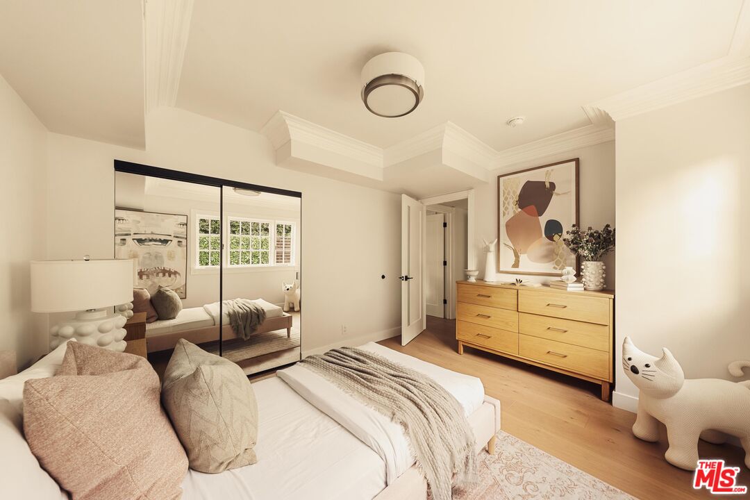 222 14th Street Santa Monica, CA 90402 - Photo 35 of 42 a bedroom with a bed and large windows